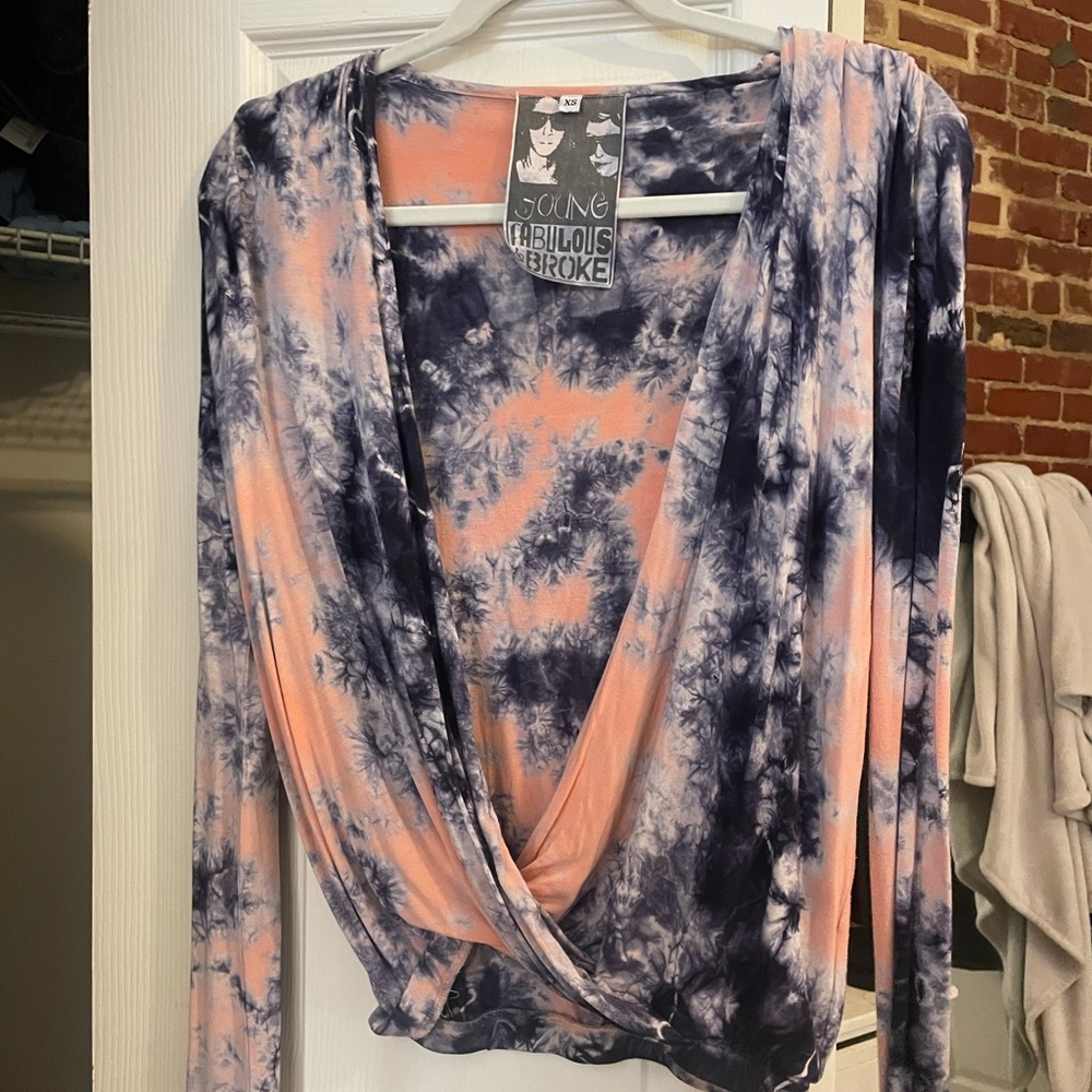 Cute tie dye wrap shirt. Very flattering on and comfy